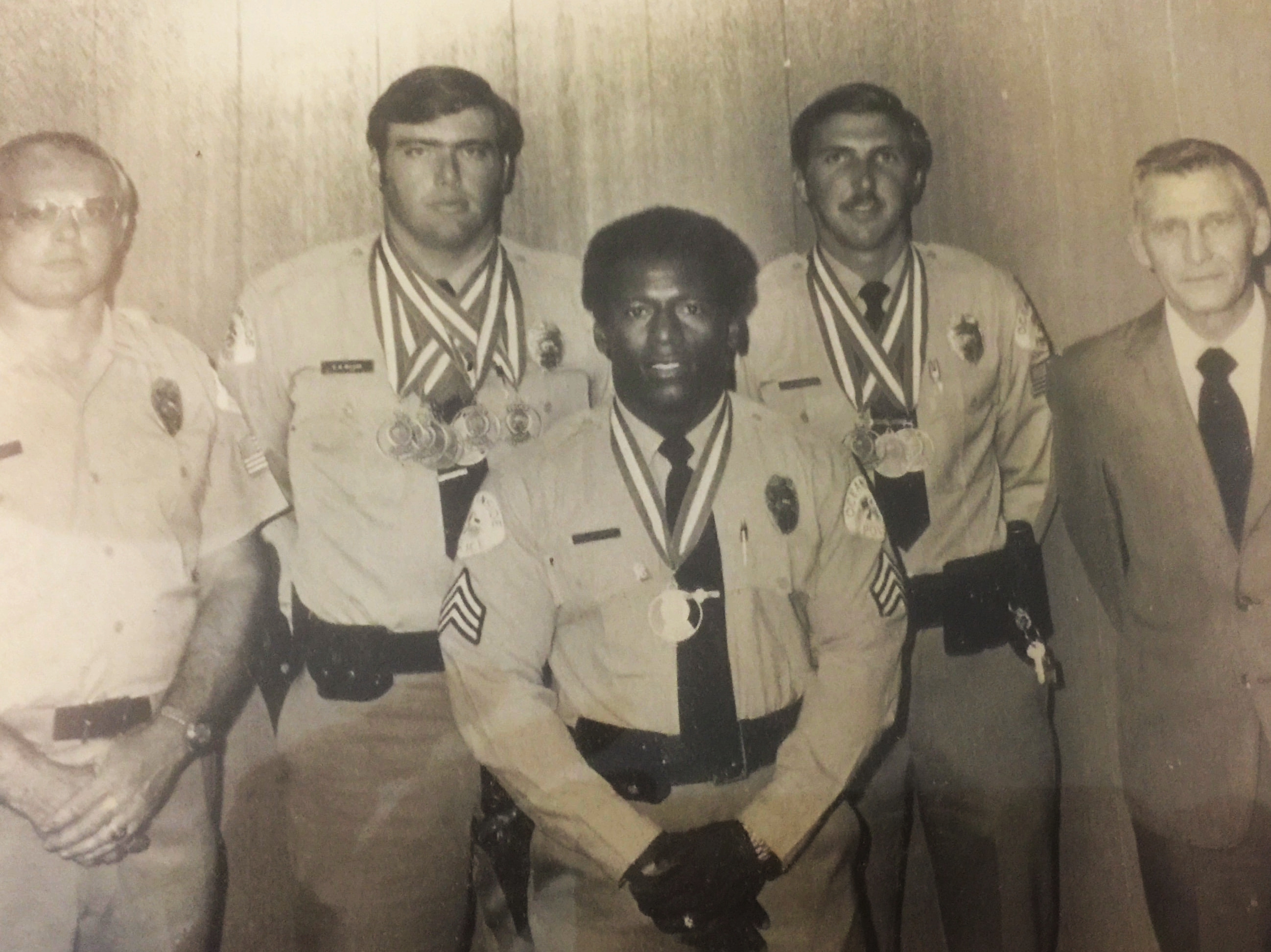 Vintage group photograph of uniformed officers wearing medals